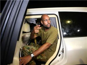 Who is behind the killing of late ruler Gaddafi`s son, and why now?