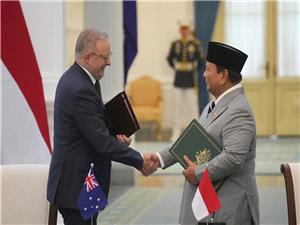 Leaders of Indonesia and Australia sign a new security treaty to affirm deeper ties