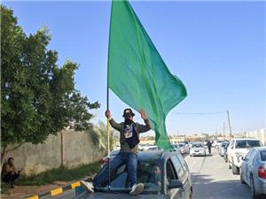 Thousands attend burial of slain son of Libya`s Gaddafi
