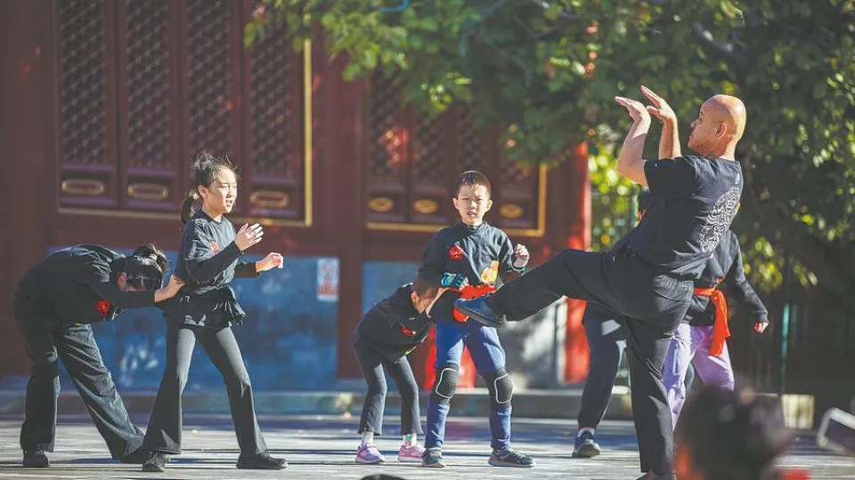 A roar of tradition: Beijing master passes on lion dance legacy